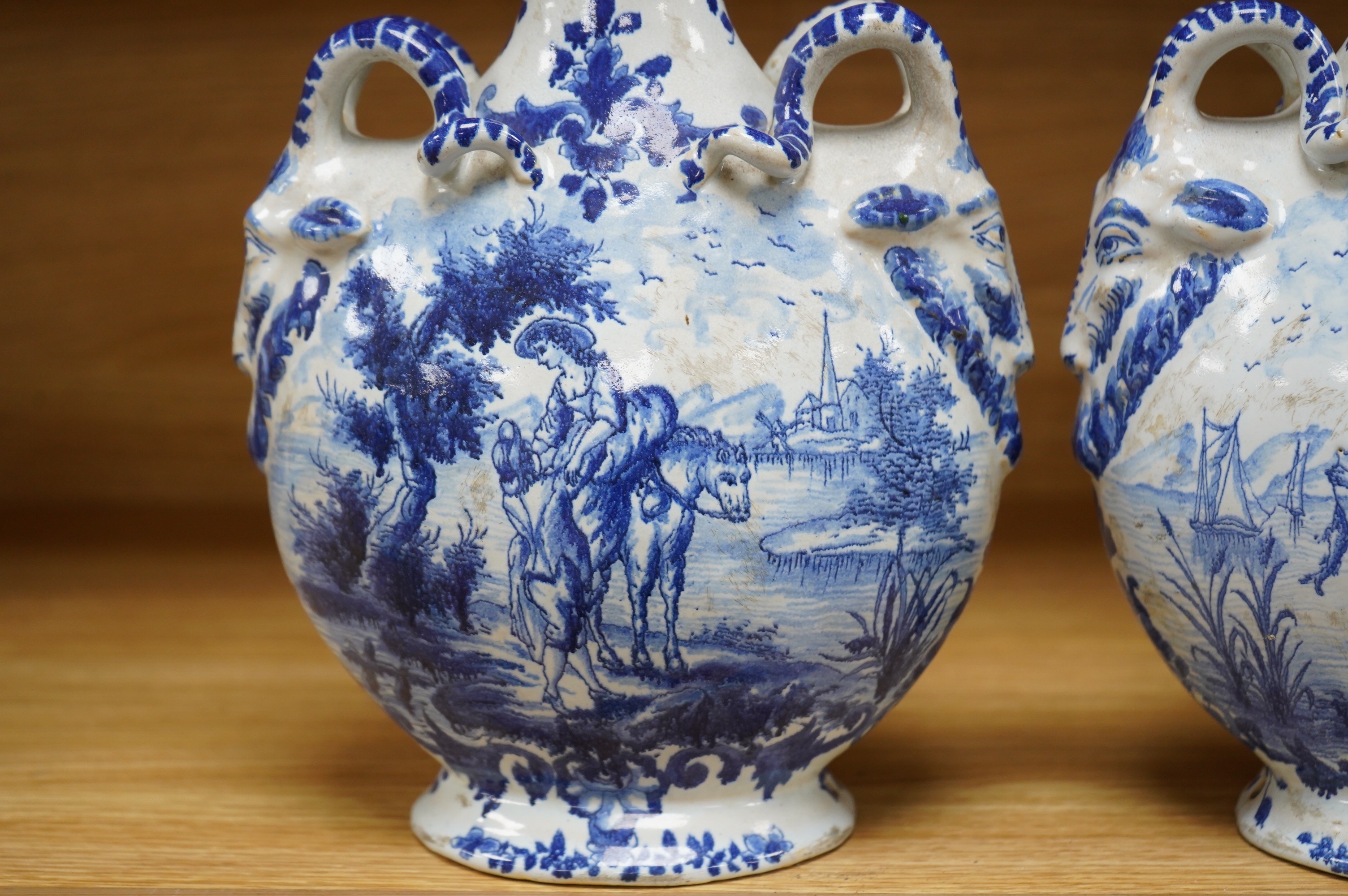 A pair of mid 18th century Delft blue and white flagons